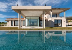 Cortizo slimline sliding doors on modern property with swimming pool