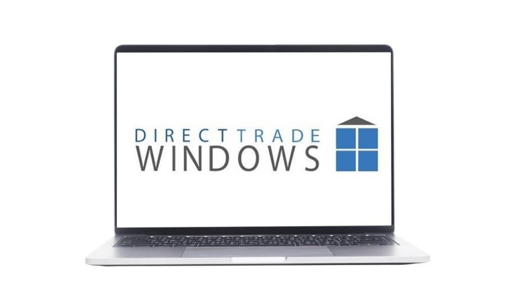 Logo of Direct Trade Windows software on a laptop screen.