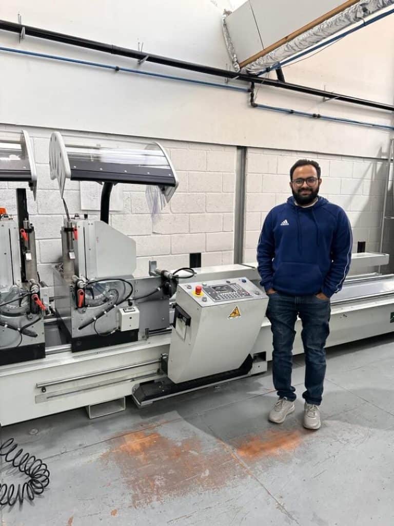 CAD engineer operating advanced machinery at Direct Trade Windows.