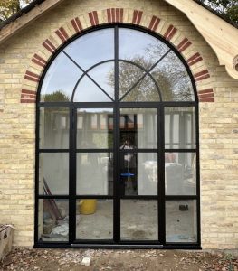 Arched black steel-look doors
